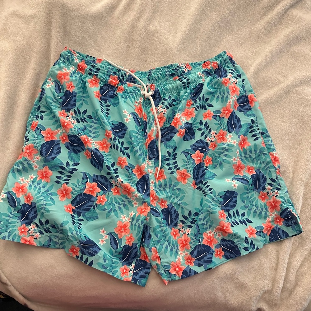 Children place men’s bathing suit